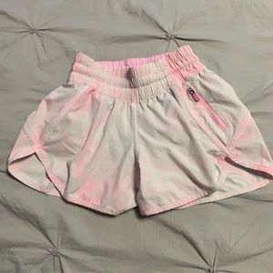 Size 2, pink and white, lululemon shorts with a zipper and an adjustable strap.